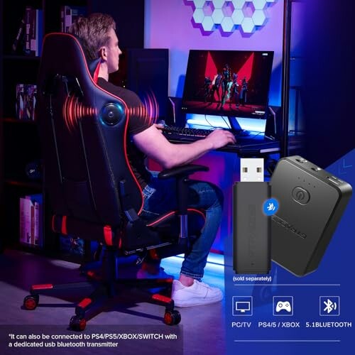 Person sitting in a gaming chair in front of a computer with a Bluetooth adapter displayed.